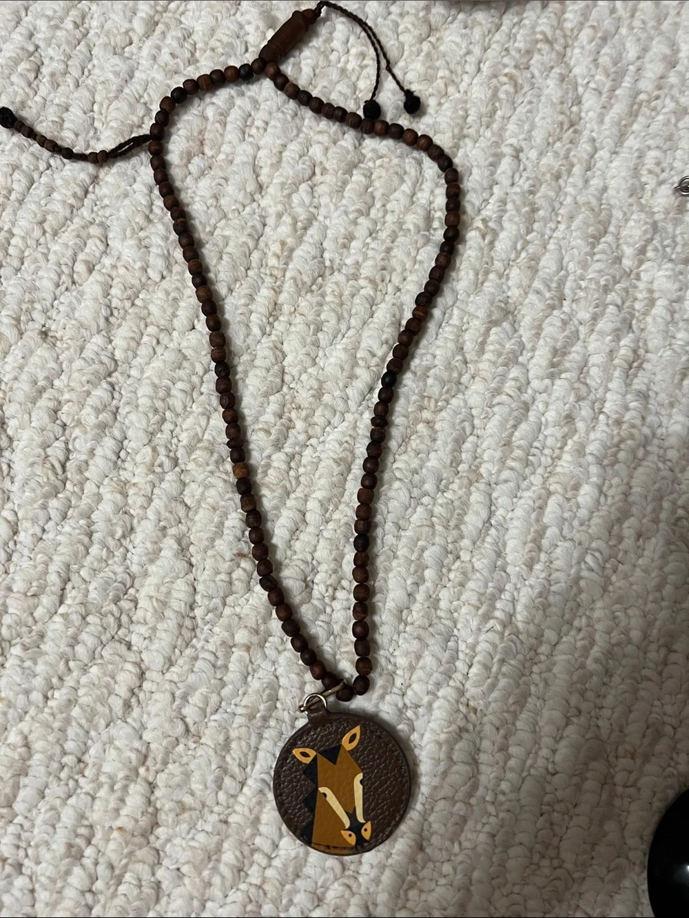 Estée Lauder Brown Wood Bead Necklace with Fox Pendant